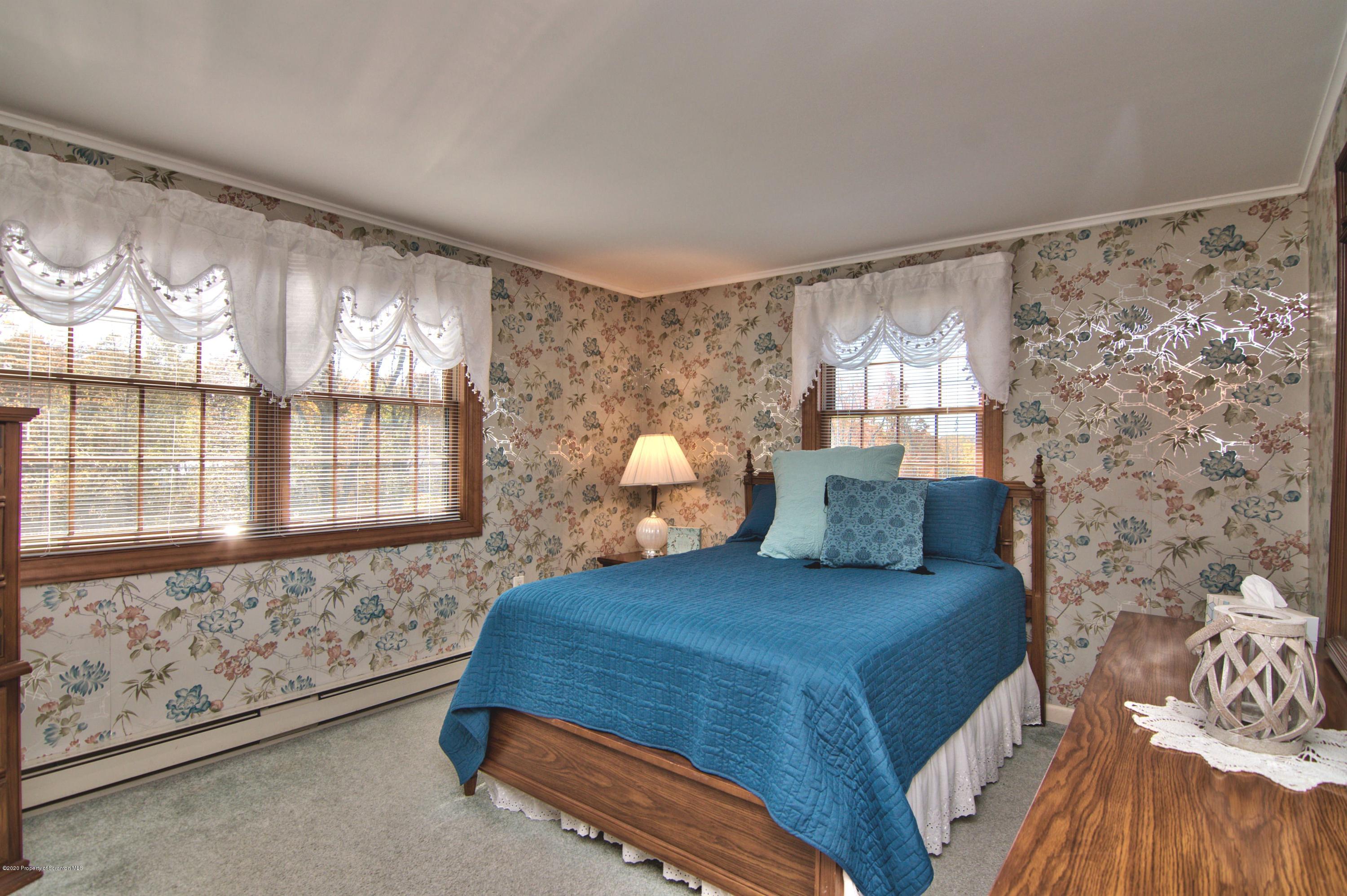 2151 Aberdeen Road Moscow, PA 18444 - Photo 23 of 65 a bedroom with a bed and a large window with outer view