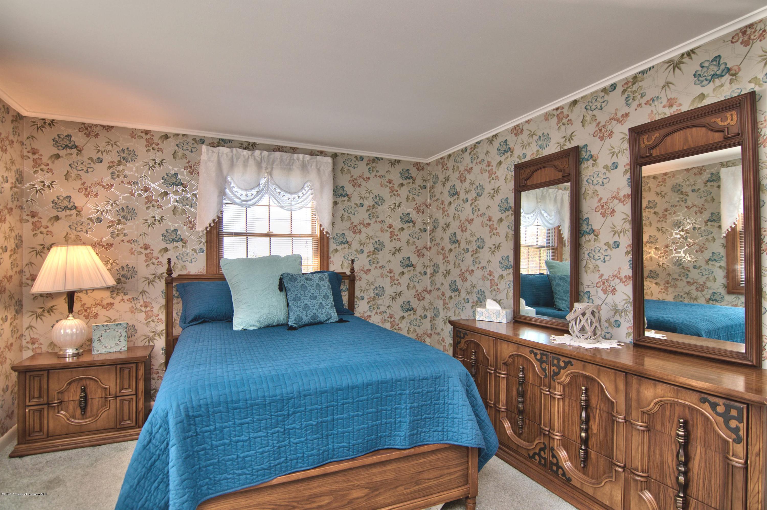 2151 Aberdeen Road Moscow, PA 18444 - Photo 25 of 65 a bedroom with a bed and a large window with outer view