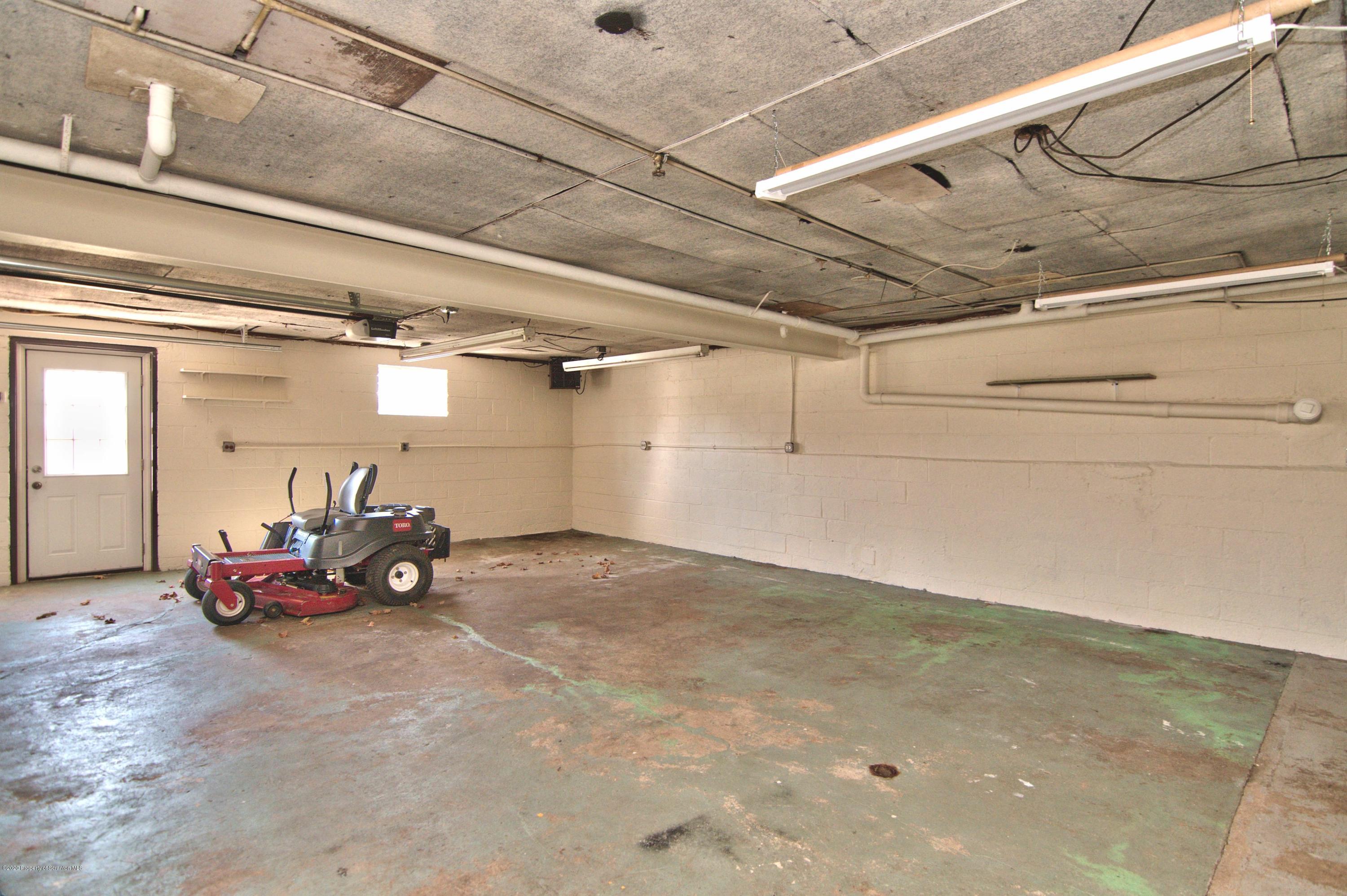 2151 Aberdeen Road Moscow, PA 18444 - Photo 44 of 65 a view of a garage with parked cars