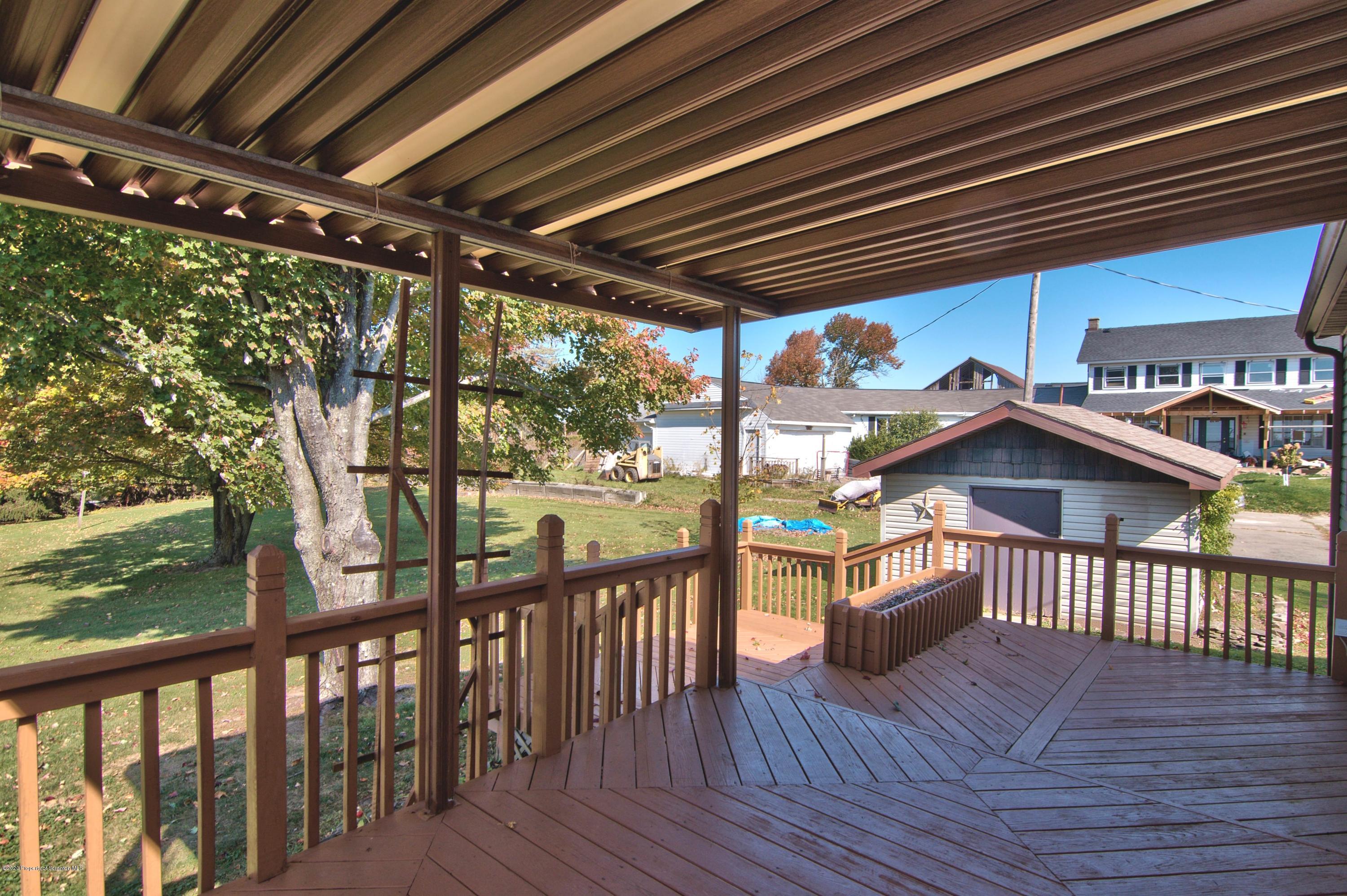 2151 Aberdeen Road Moscow, PA 18444 - Photo 50 of 65 a view of a porch with furniture and wooden floor