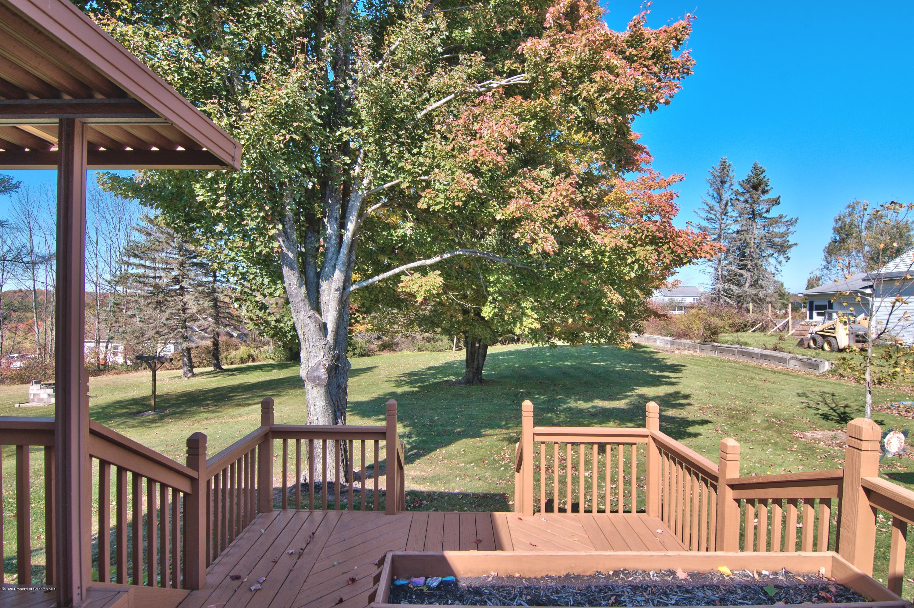 2151 Aberdeen Road Moscow, PA 18444 - Photo 51 of 65 a view of a wooden deck with lake view