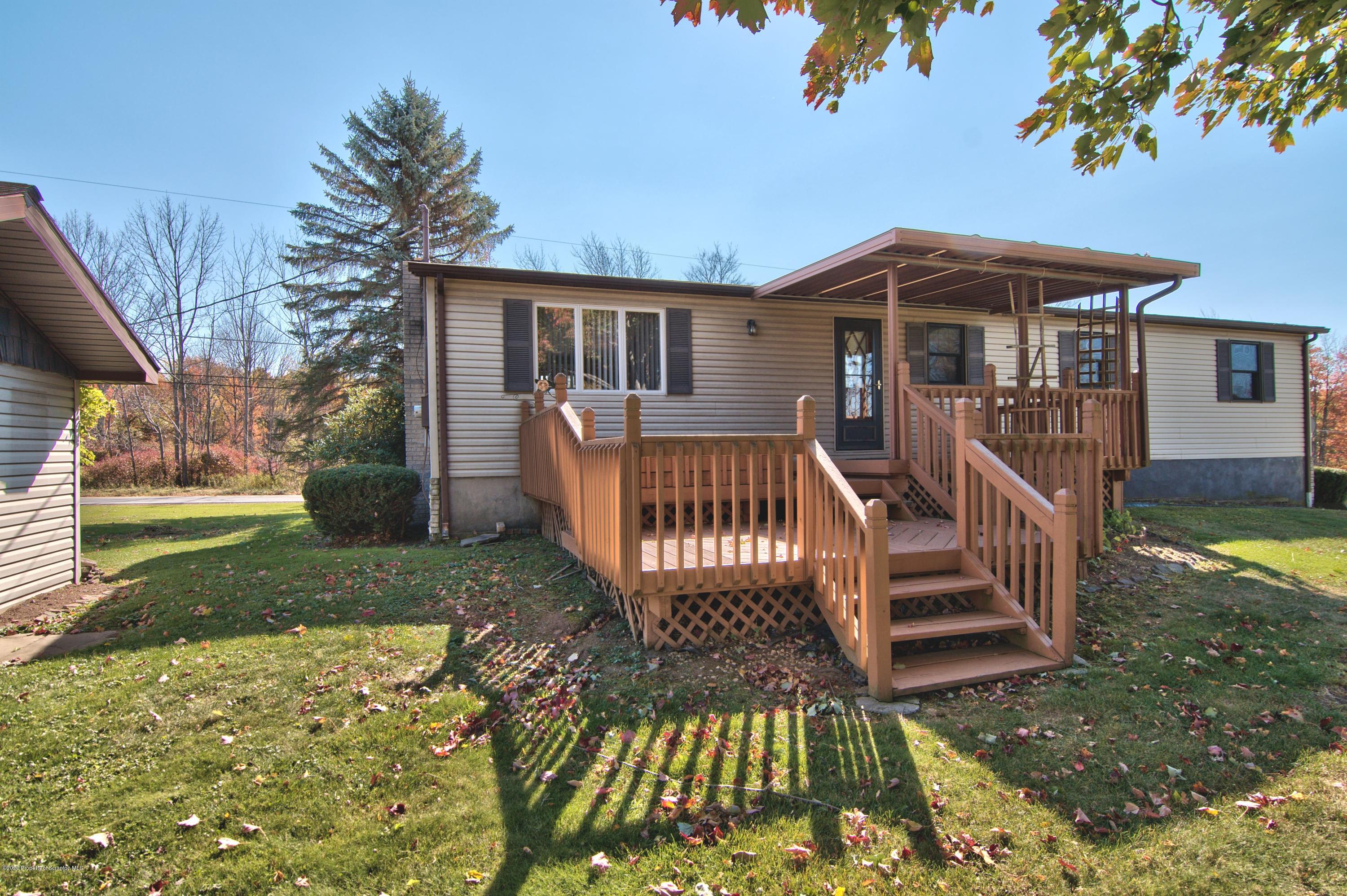 2151 Aberdeen Road Moscow, PA 18444 - Photo 56 of 65 a view of a house with backyard and porch