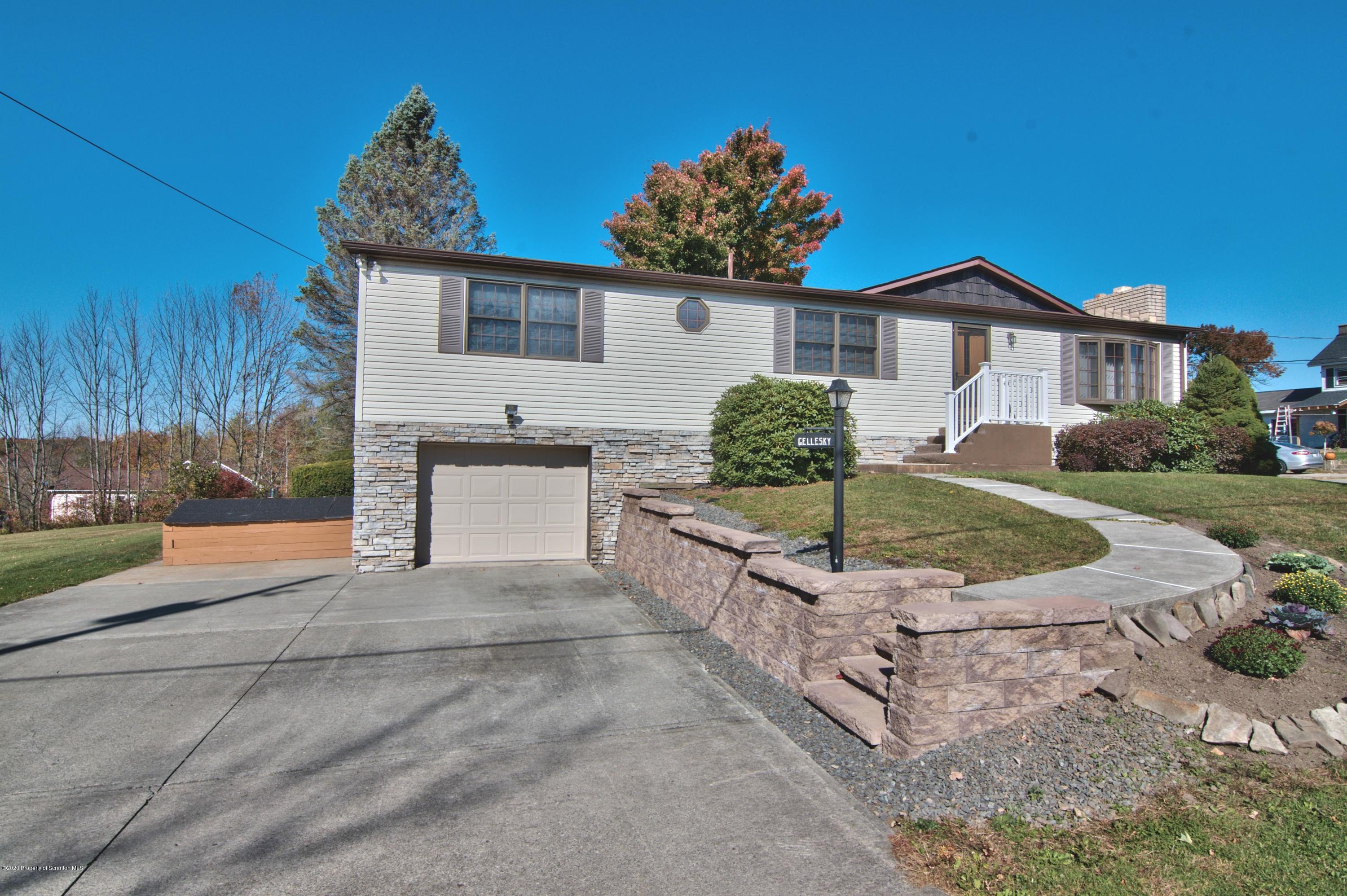 2151 Aberdeen Road Moscow, PA 18444 - Photo 60 of 65 a front view of a house with a yard and garage