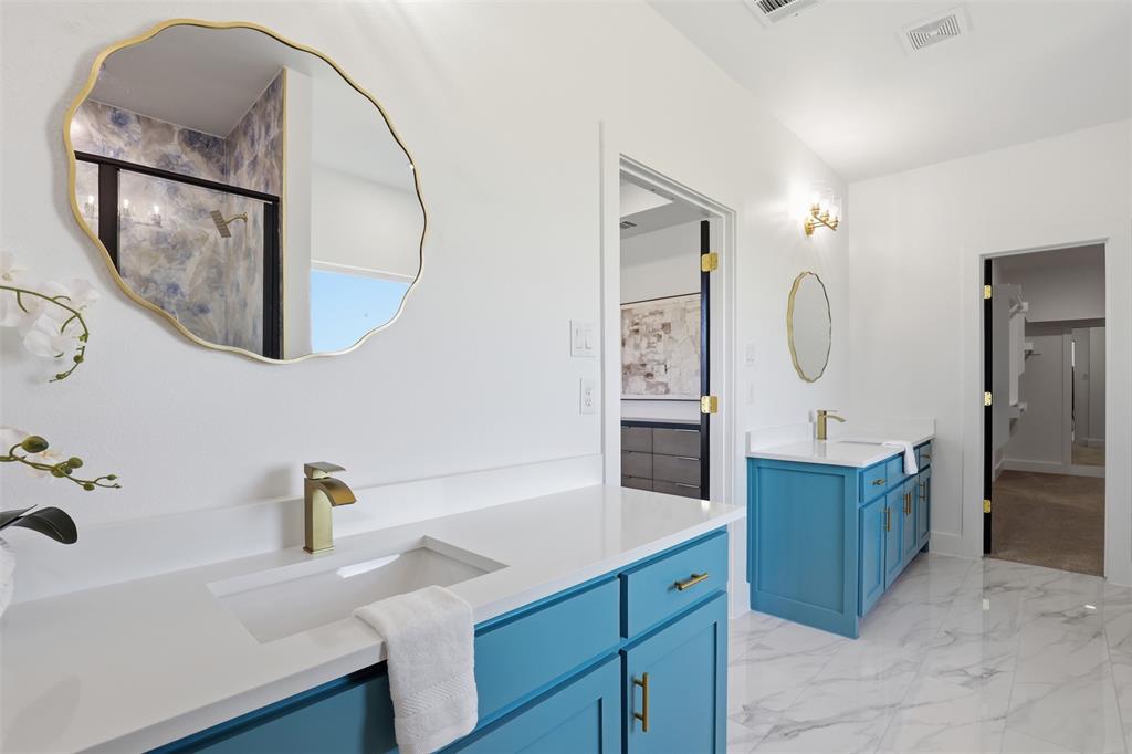 6657 Buffalo Ridge Circle Godley, TX 76044 - Photo 22 of 31 a bathroom with a sink vanity and mirror