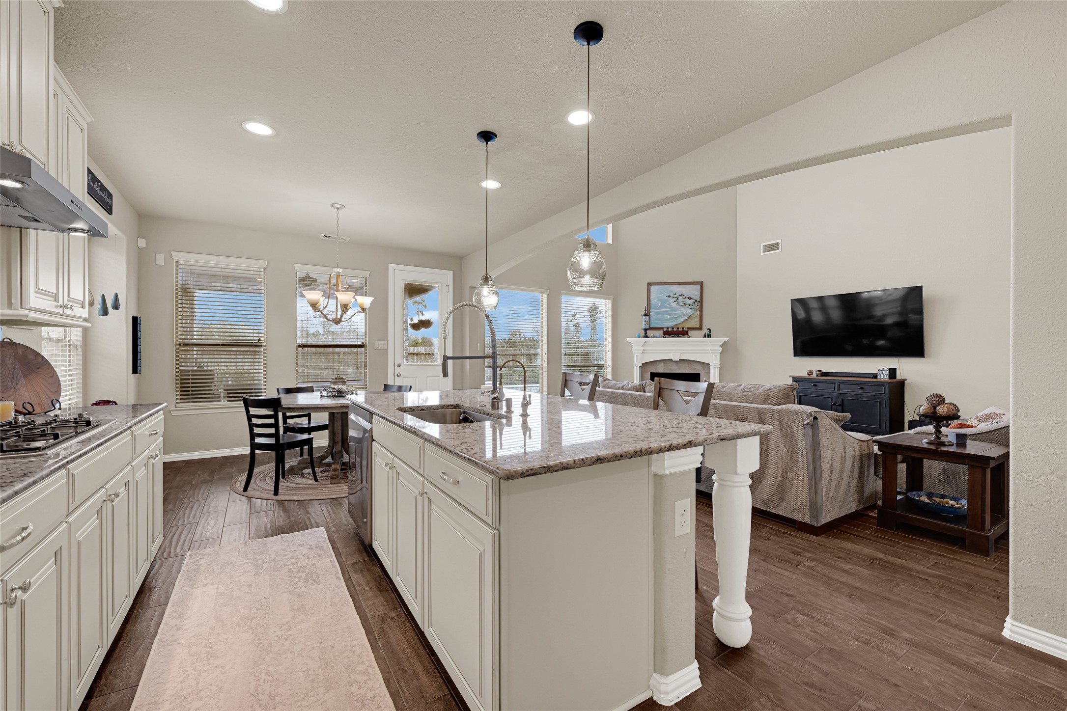 10319 Silver Shield Way Tomball, TX 77375 - Photo 11 of 46 a kitchen with cabinets a sink and appliances