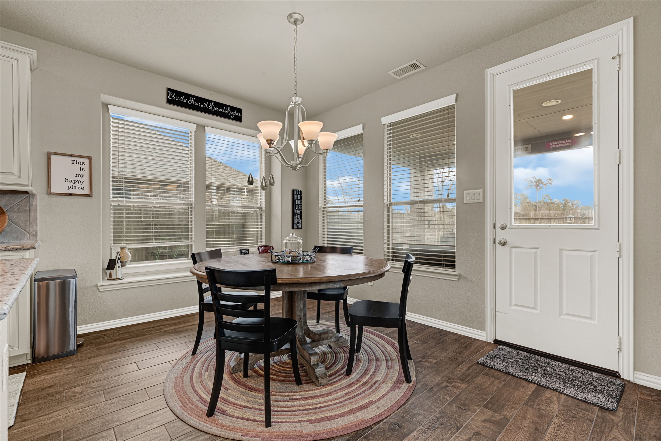 10319 Silver Shield Way Tomball, TX 77375 - Photo 14 of 46 a view of a dining room with furniture window and wooden floor