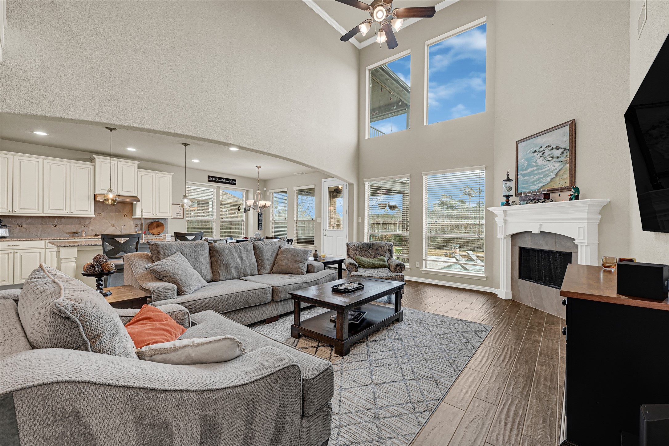 10319 Silver Shield Way Tomball, TX 77375 - Photo 16 of 46 a living room with furniture fireplace and flat screen tv