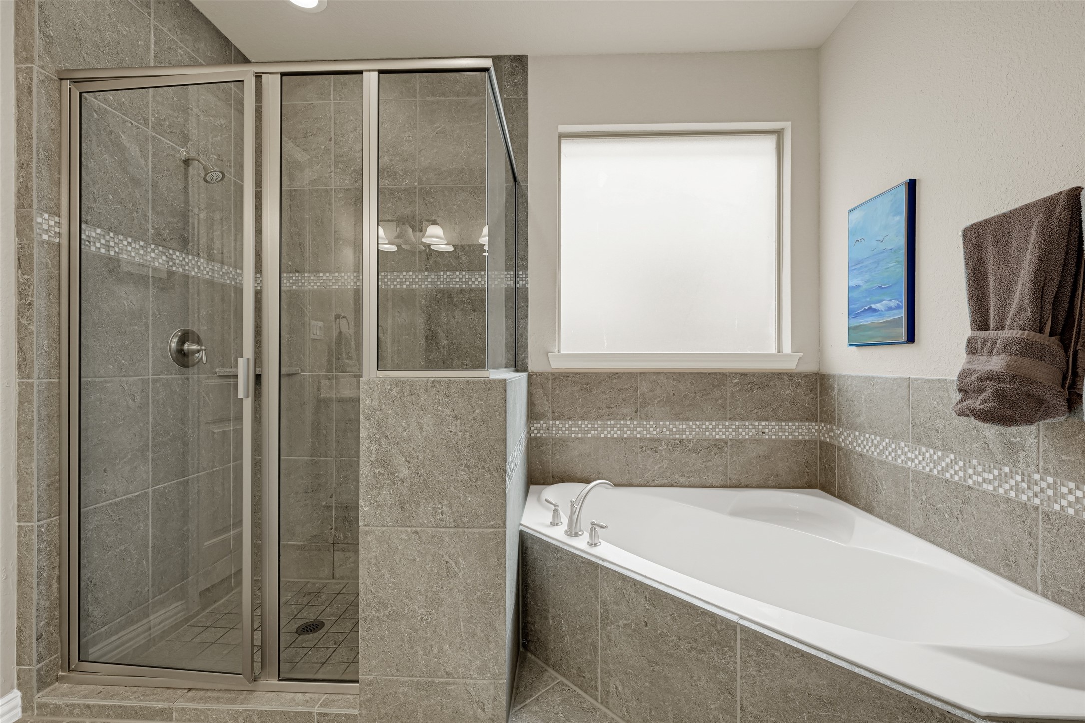 10319 Silver Shield Way Tomball, TX 77375 - Photo 21 of 46 a bathroom with a bathtub and a shower