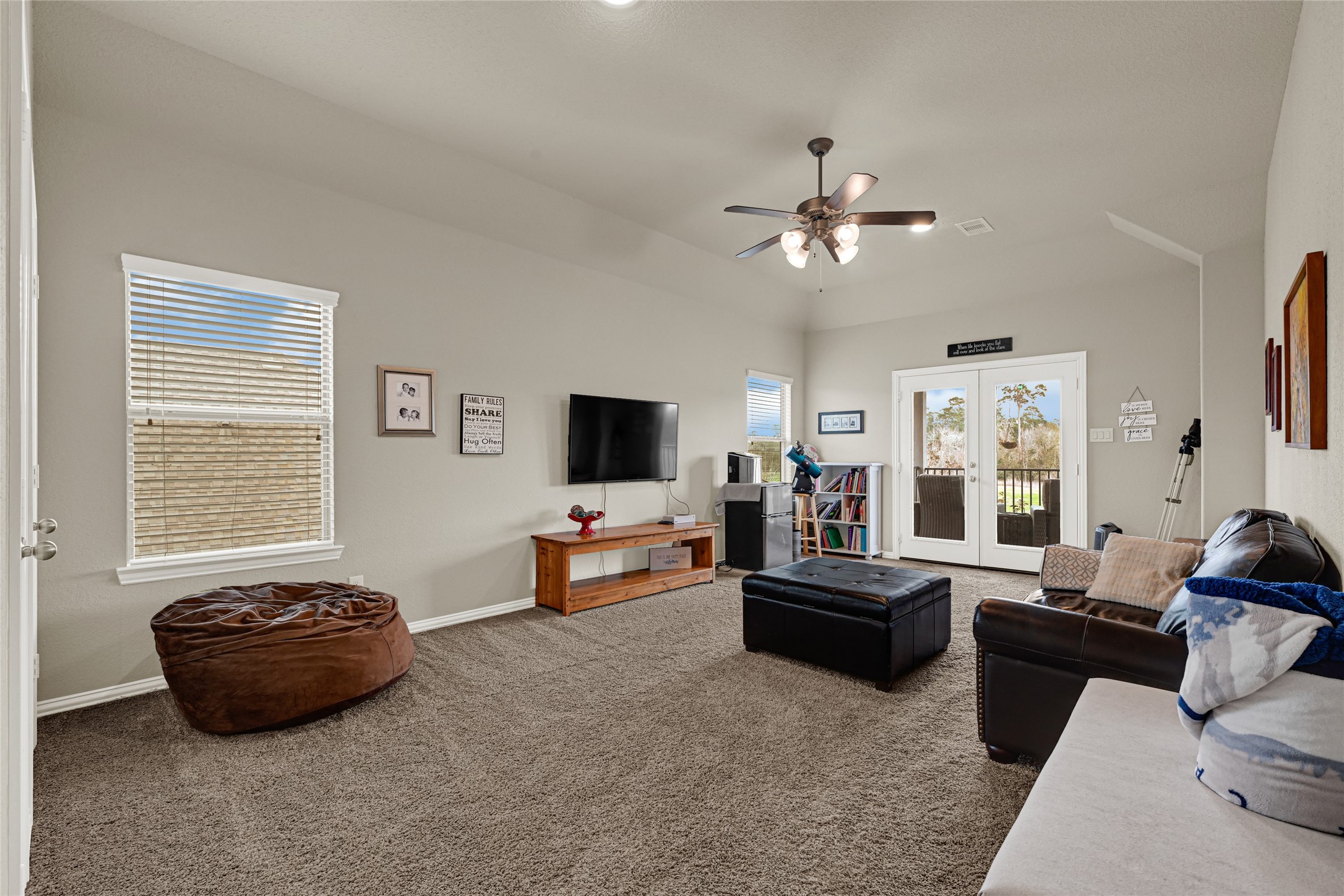 10319 Silver Shield Way Tomball, TX 77375 - Photo 25 of 46 a living room with furniture and a flat screen tv