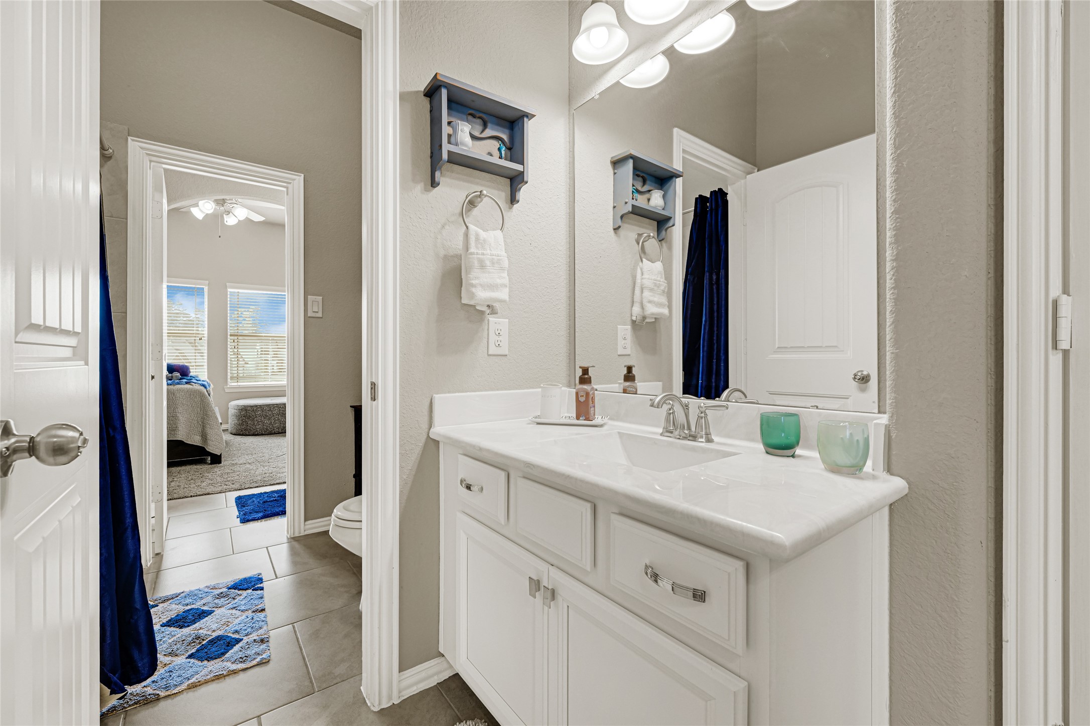 10319 Silver Shield Way Tomball, TX 77375 - Photo 31 of 46 a bathroom with a double vanity sink mirror and shower