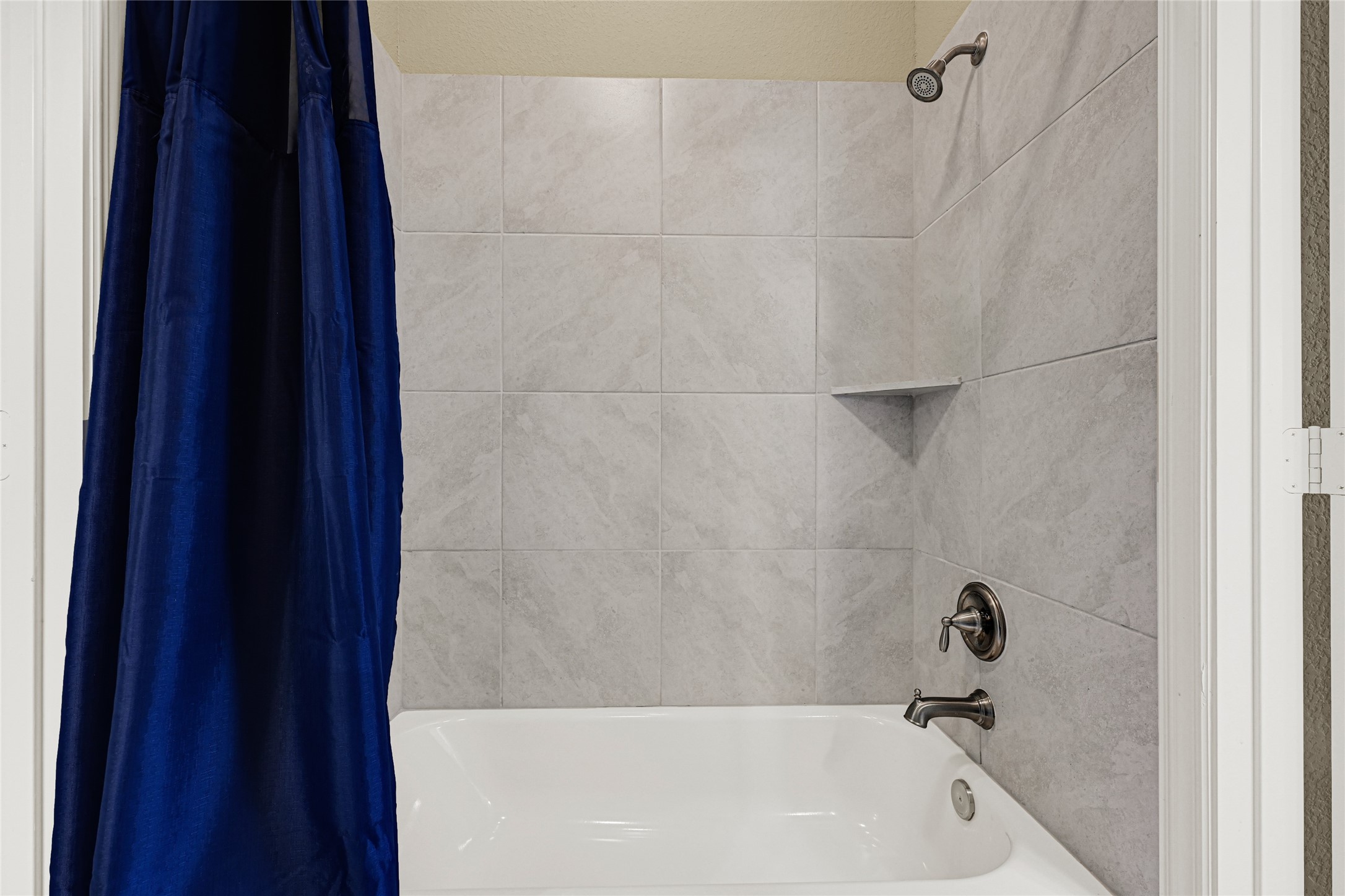 10319 Silver Shield Way Tomball, TX 77375 - Photo 32 of 46 a bathroom with a bathtub