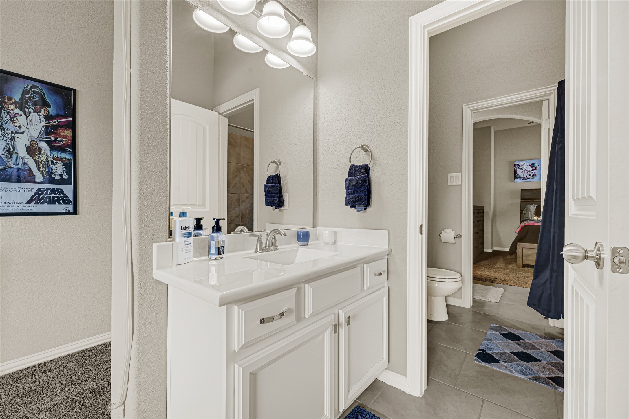 10319 Silver Shield Way Tomball, TX 77375 - Photo 33 of 46 a bathroom with a sink vanity toilet and shower