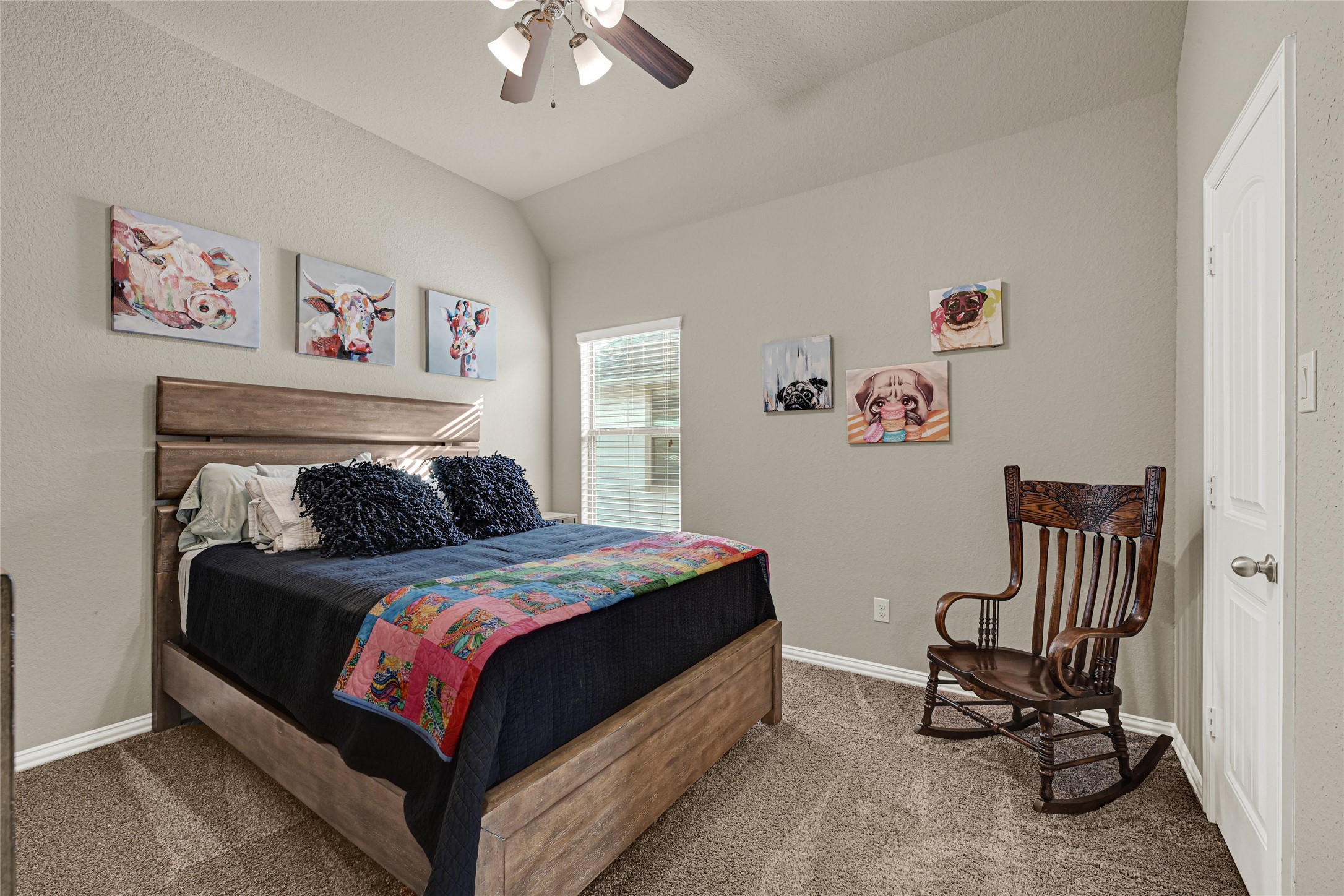 10319 Silver Shield Way Tomball, TX 77375 - Photo 34 of 46 a bedroom with a bed and a chandelier