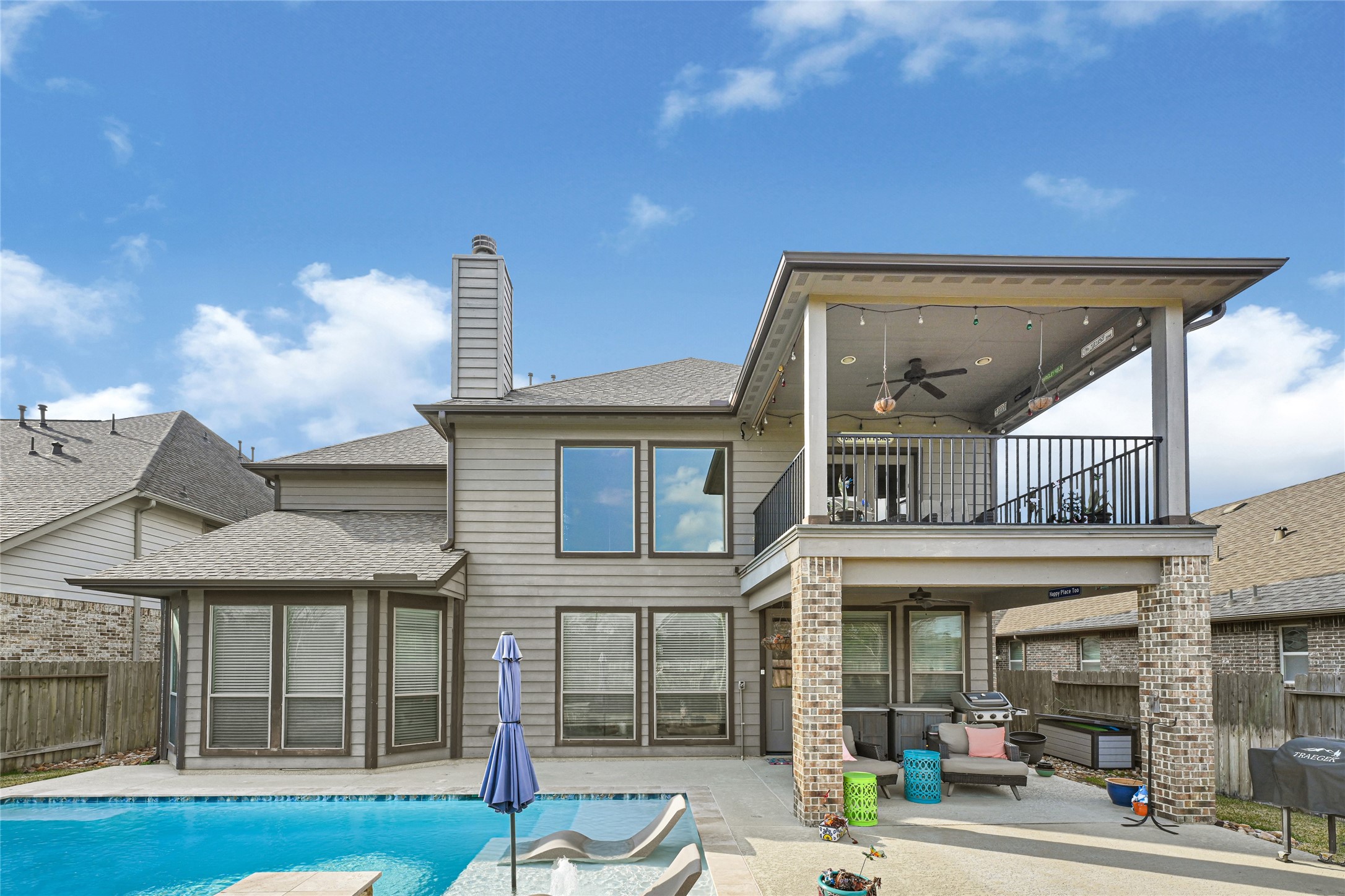 10319 Silver Shield Way Tomball, TX 77375 - Photo 38 of 46 a front view of a residential apartment building with a yard