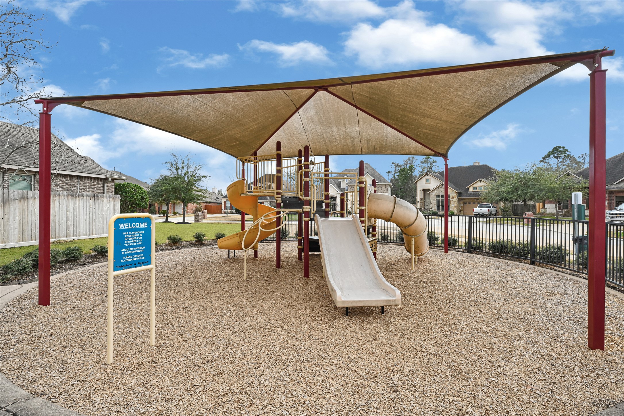 10319 Silver Shield Way Tomball, TX 77375 - Photo 43 of 46 a view of a patio with a table and chairs