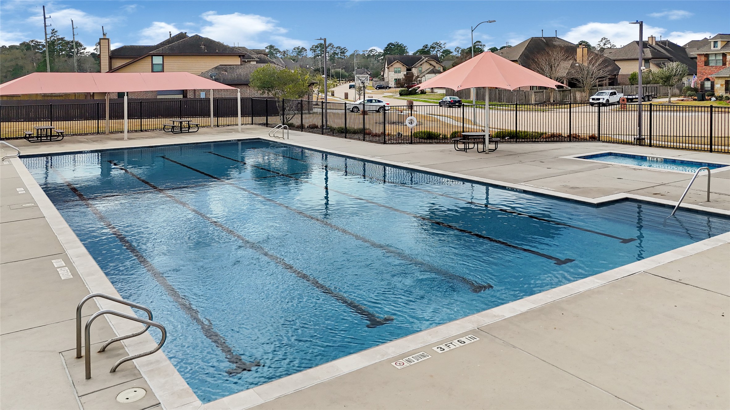10319 Silver Shield Way Tomball, TX 77375 - Photo 46 of 46 a view of a swimming pool with sitting area