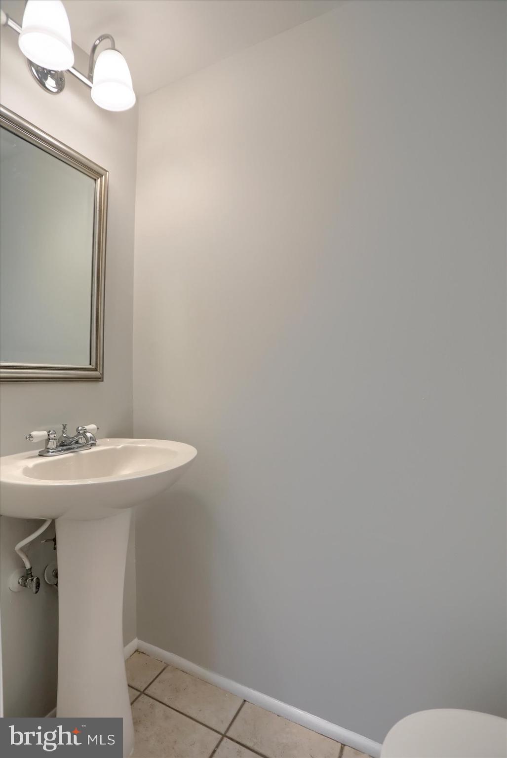 20 Stone Ridge Court, Unit 22 Baltimore, MD 21239 - Photo 7 of 37 Powder Room on Main Level
