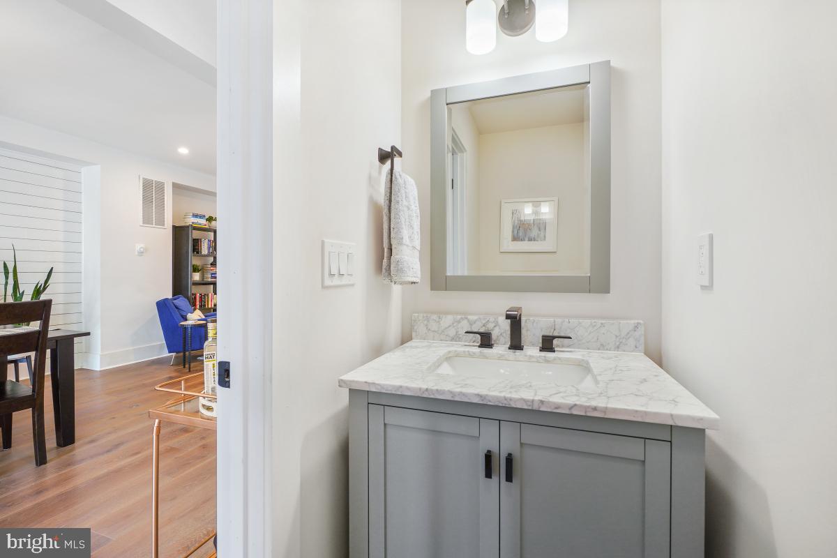 714 Decatur Street Northwest Washington, DC 20011 - Photo 13 of 40 a bathroom with a sink and a mirror