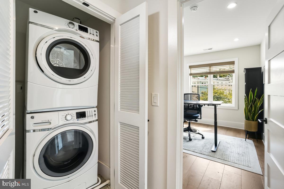 714 Decatur Street Northwest Washington, DC 20011 - Photo 22 of 40 a view of a hallway with washer and dryer