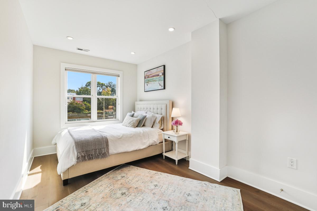 714 Decatur Street Northwest Washington, DC 20011 - Photo 23 of 40 a bedroom with a bed and a window
