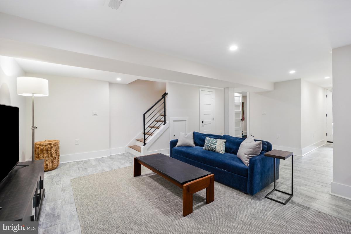 714 Decatur Street Northwest Washington, DC 20011 - Photo 27 of 40 a living room with furniture and a couch