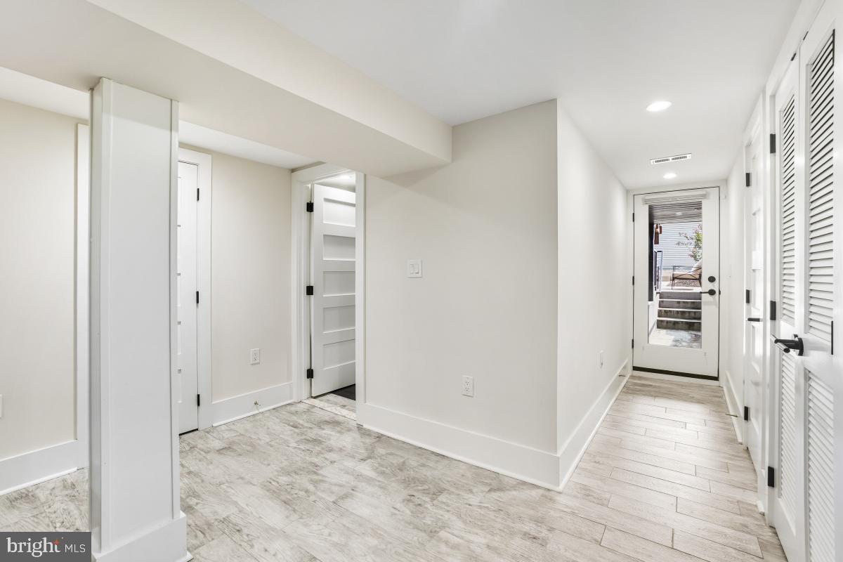 714 Decatur Street Northwest Washington, DC 20011 - Photo 30 of 40 a view of a hallway with wooden floor and closet area