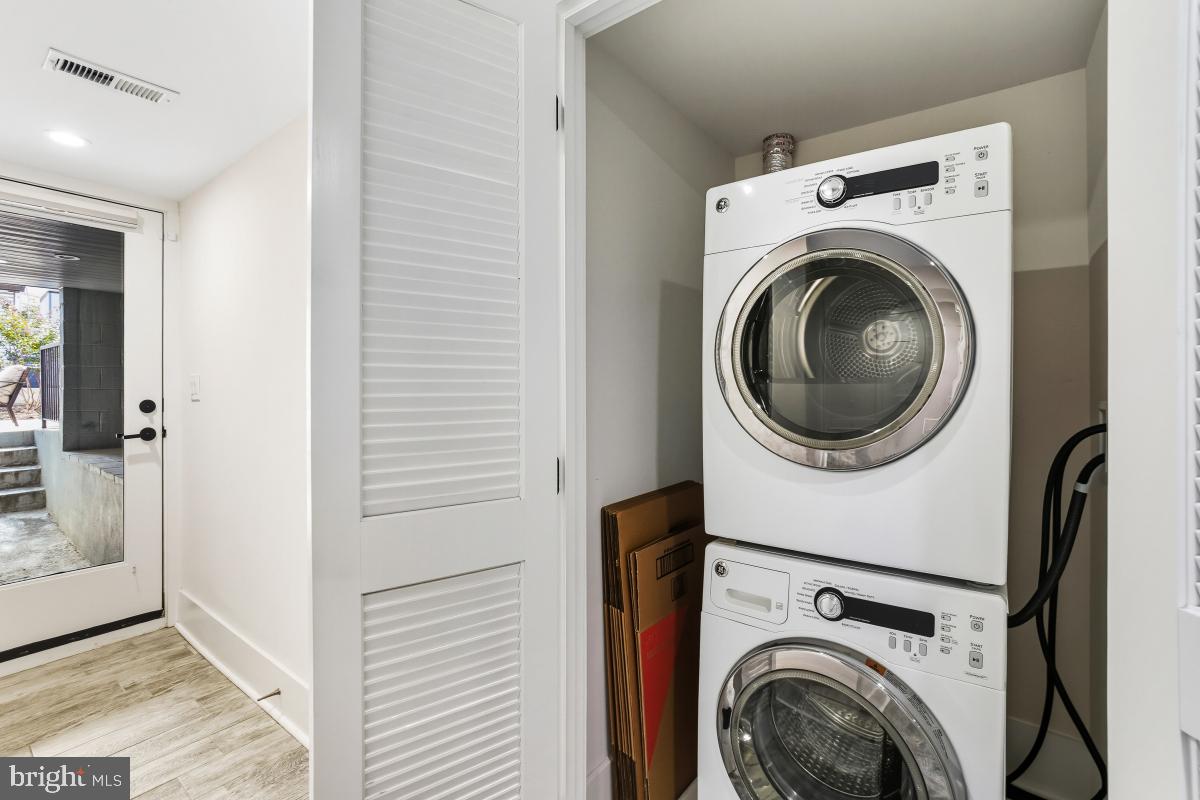 714 Decatur Street Northwest Washington, DC 20011 - Photo 31 of 40 a view of a hallway with washer and dryer