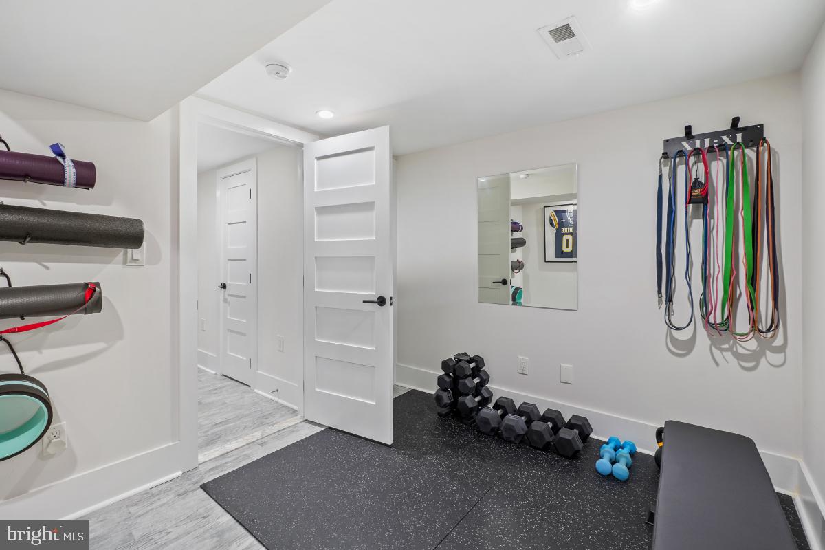 714 Decatur Street Northwest Washington, DC 20011 - Photo 33 of 40 a room with lots of stuff and hardwood floor