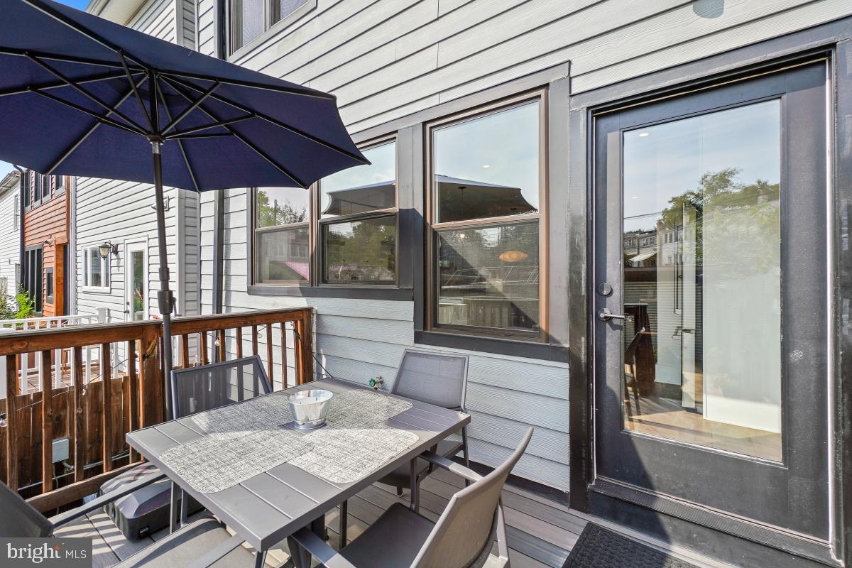 714 Decatur Street Northwest Washington, DC 20011 - Photo 35 of 40 a view of a balcony and a chair and the umbrella