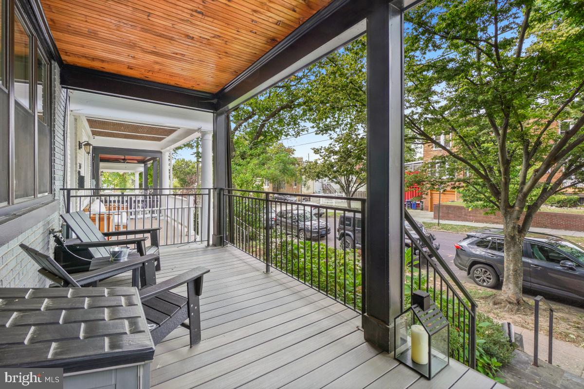 714 Decatur Street Northwest Washington, DC 20011 - Photo 6 of 40 a view of balcony with wooden floor and outdoor seating