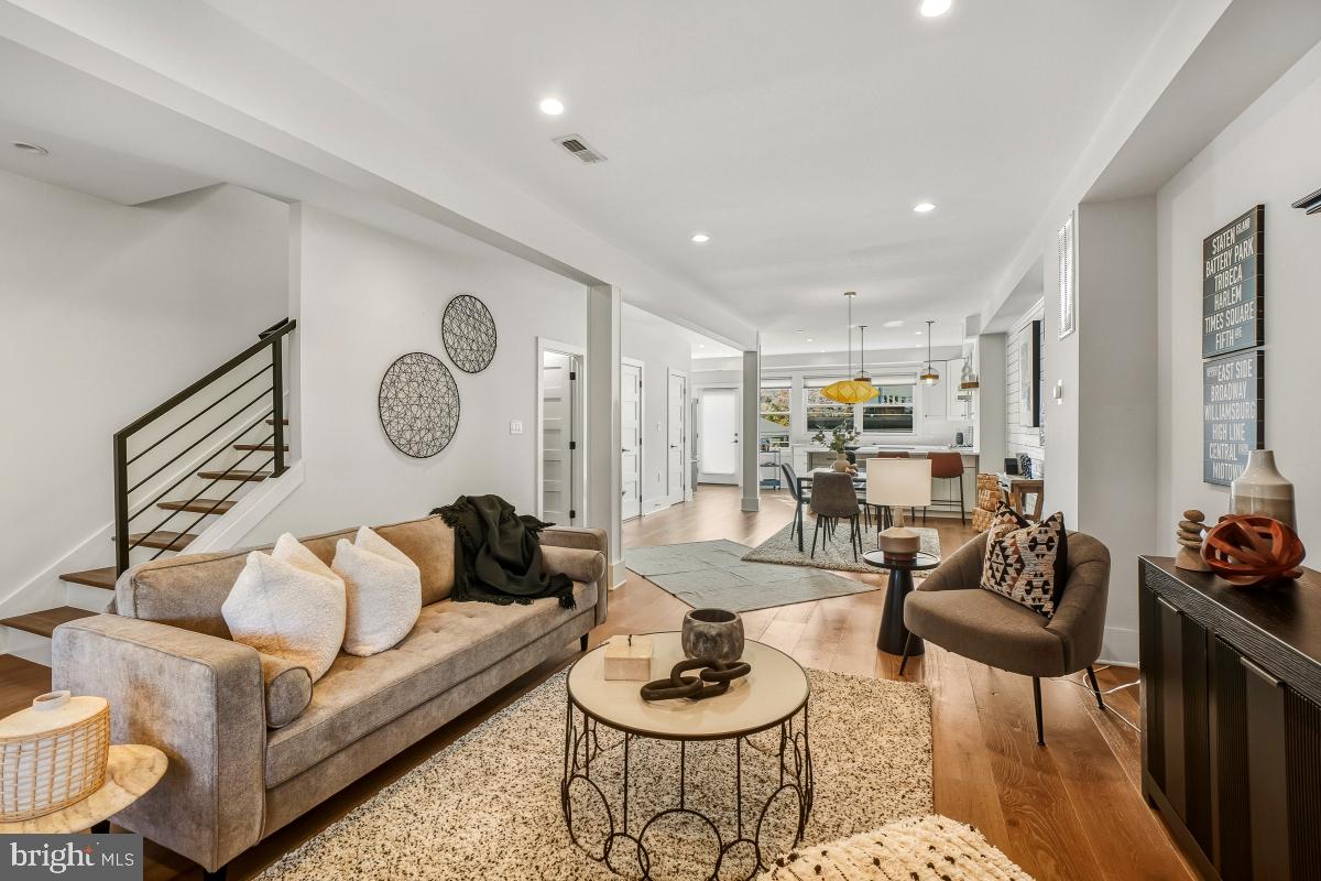 714 Decatur Street Northwest Washington, DC 20011 - Photo 40 of 40 a living room with furniture and a wooden floor