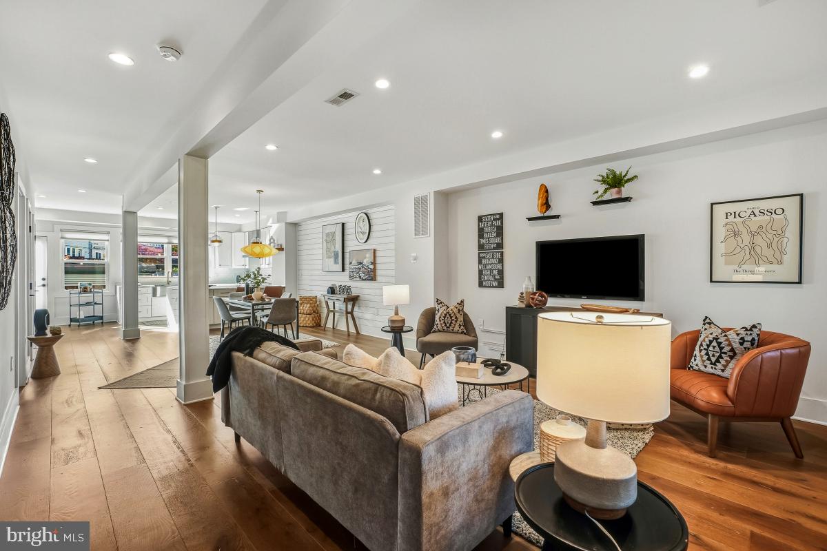714 Decatur Street Northwest Washington, DC 20011 - Photo 8 of 40 a living room with furniture and a flat screen tv
