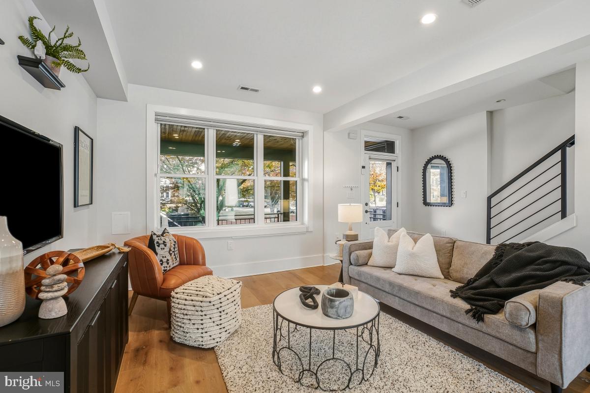 714 Decatur Street Northwest Washington, DC 20011 - Photo 9 of 40 a living room with furniture and a flat screen tv