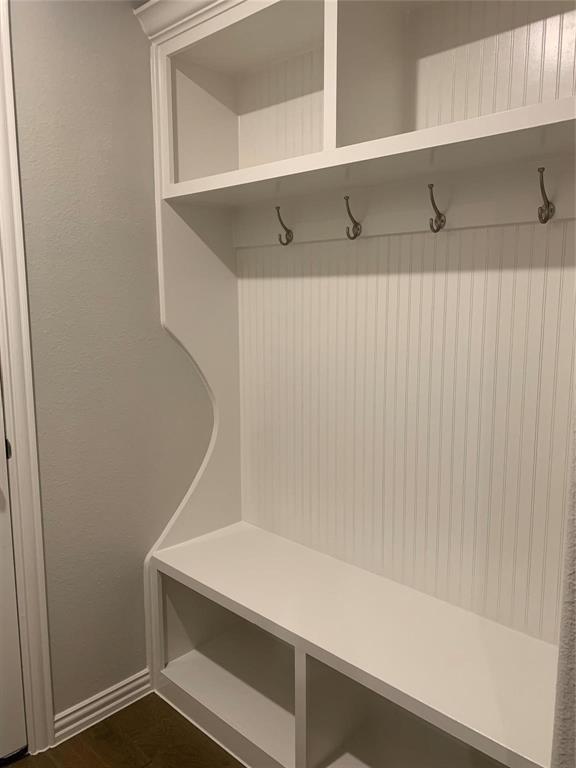5537 Yellowstone Road The Colony, TX 75056 - Photo 16 of 25 Mudroom with dark wood-type flooring and baseboards