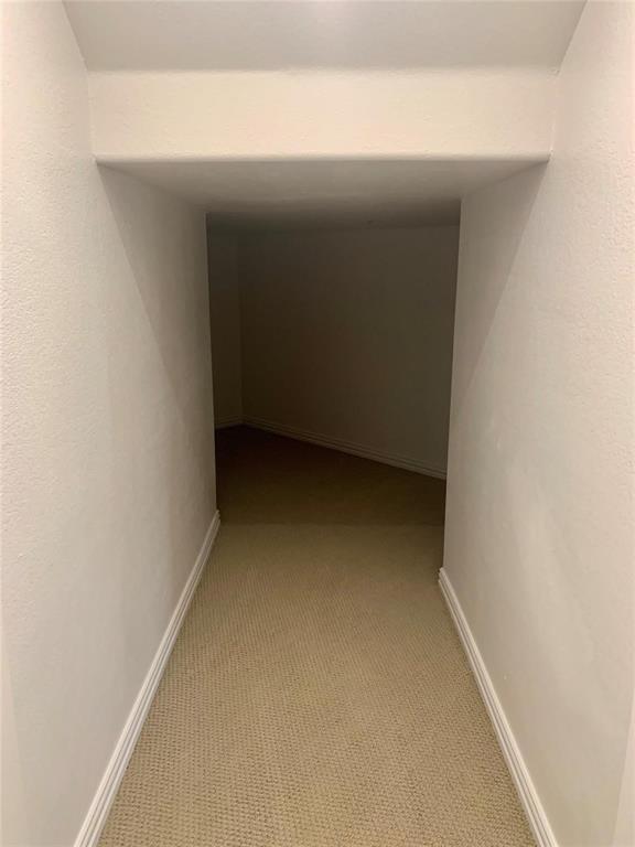 5537 Yellowstone Road The Colony, TX 75056 - Photo 20 of 25 Hall featuring carpet floors and baseboards