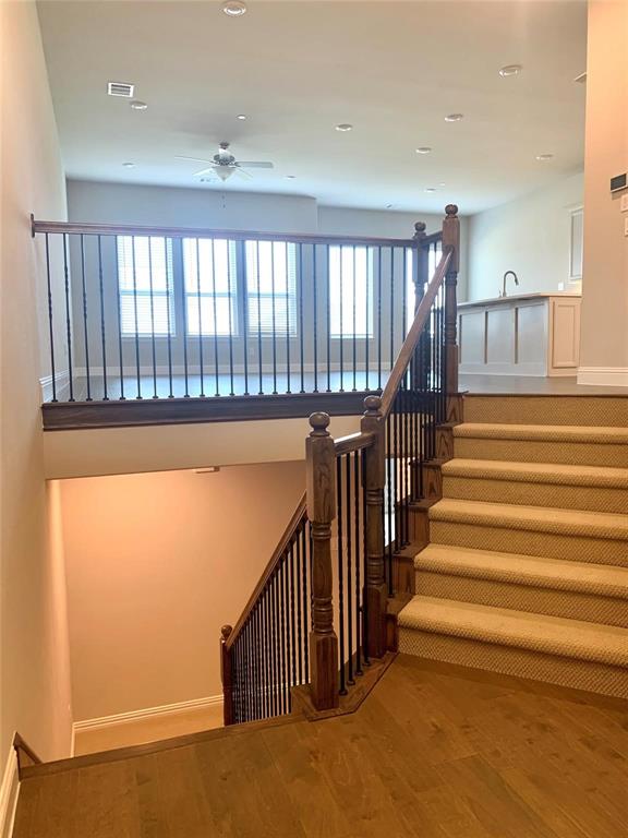 5537 Yellowstone Road The Colony, TX 75056 - Photo 7 of 25 Staircase featuring wood finished floors, a ceiling fan, and recessed lighting