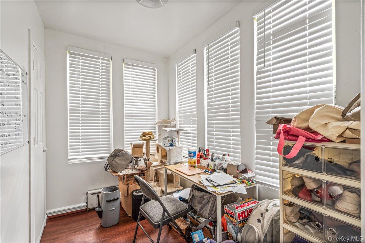 34-49 110th Street Queens, NY 11368 - Photo 3 of 21 a view of a workspace with furniture and a window