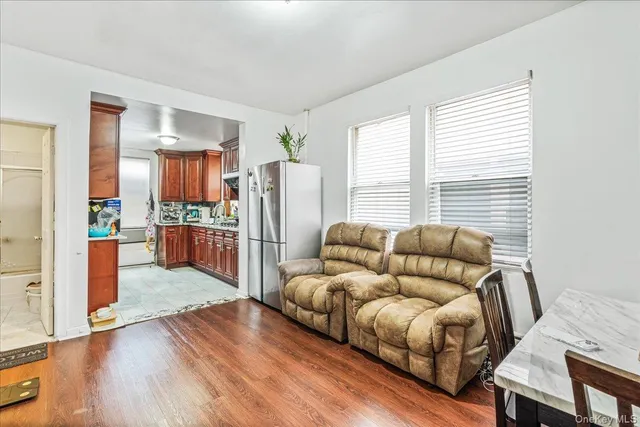 a living room with furniture and a kitchen