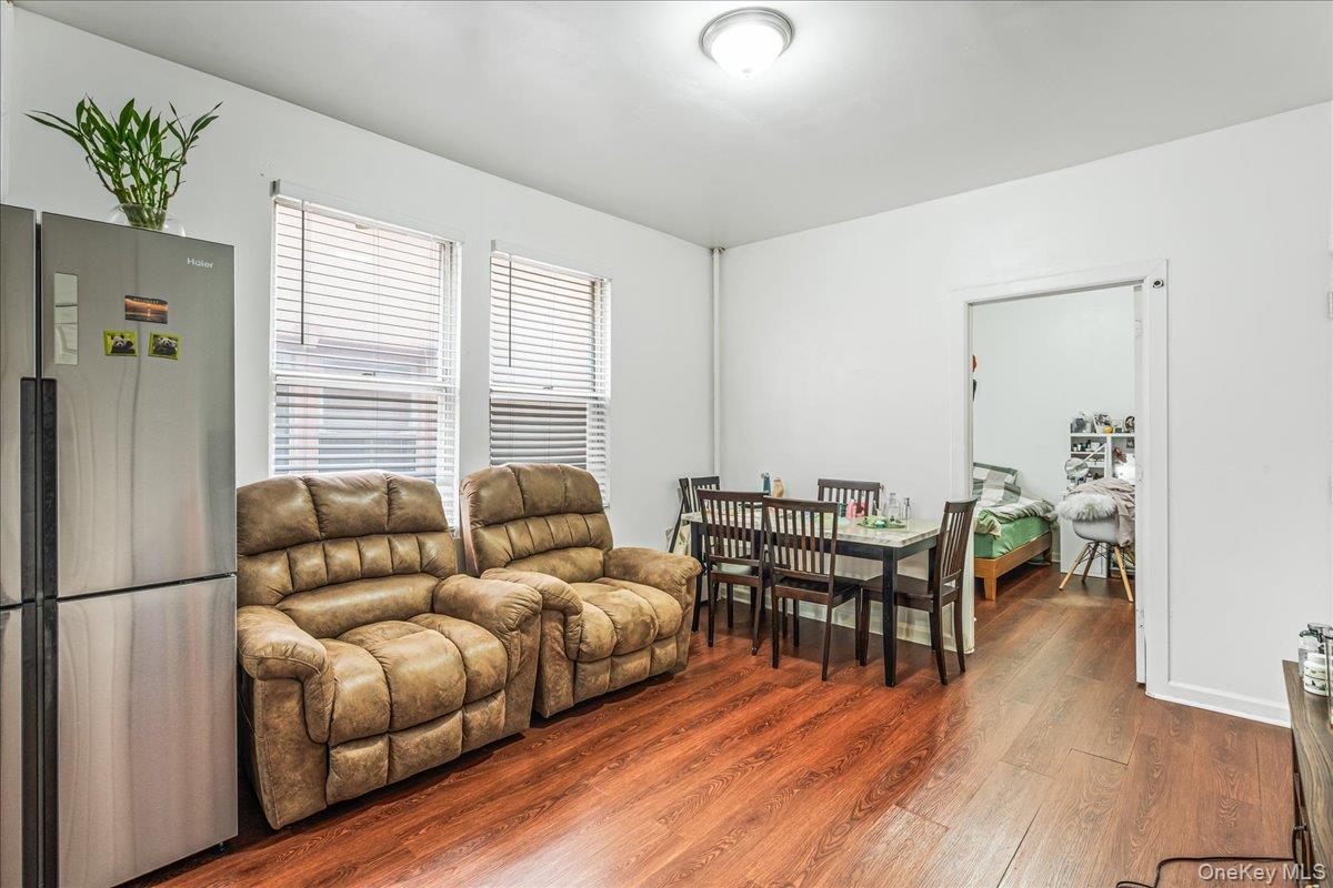 34-49 110th Street Queens, NY 11368 - Photo 6 of 21 a living room with furniture and a wooden floor