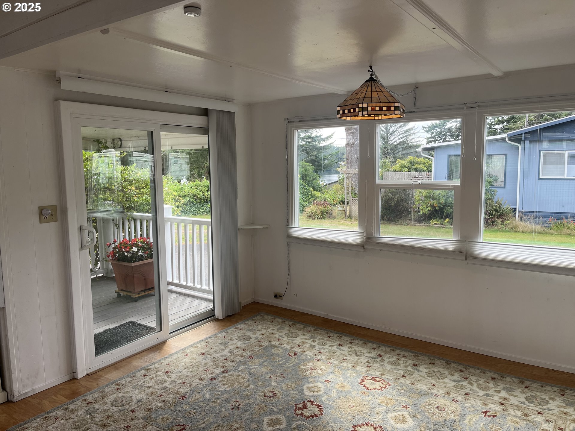 83763 Highway 101, Unit 14 Florence, OR 97439 - Photo 20 of 33 a view of an empty room and window