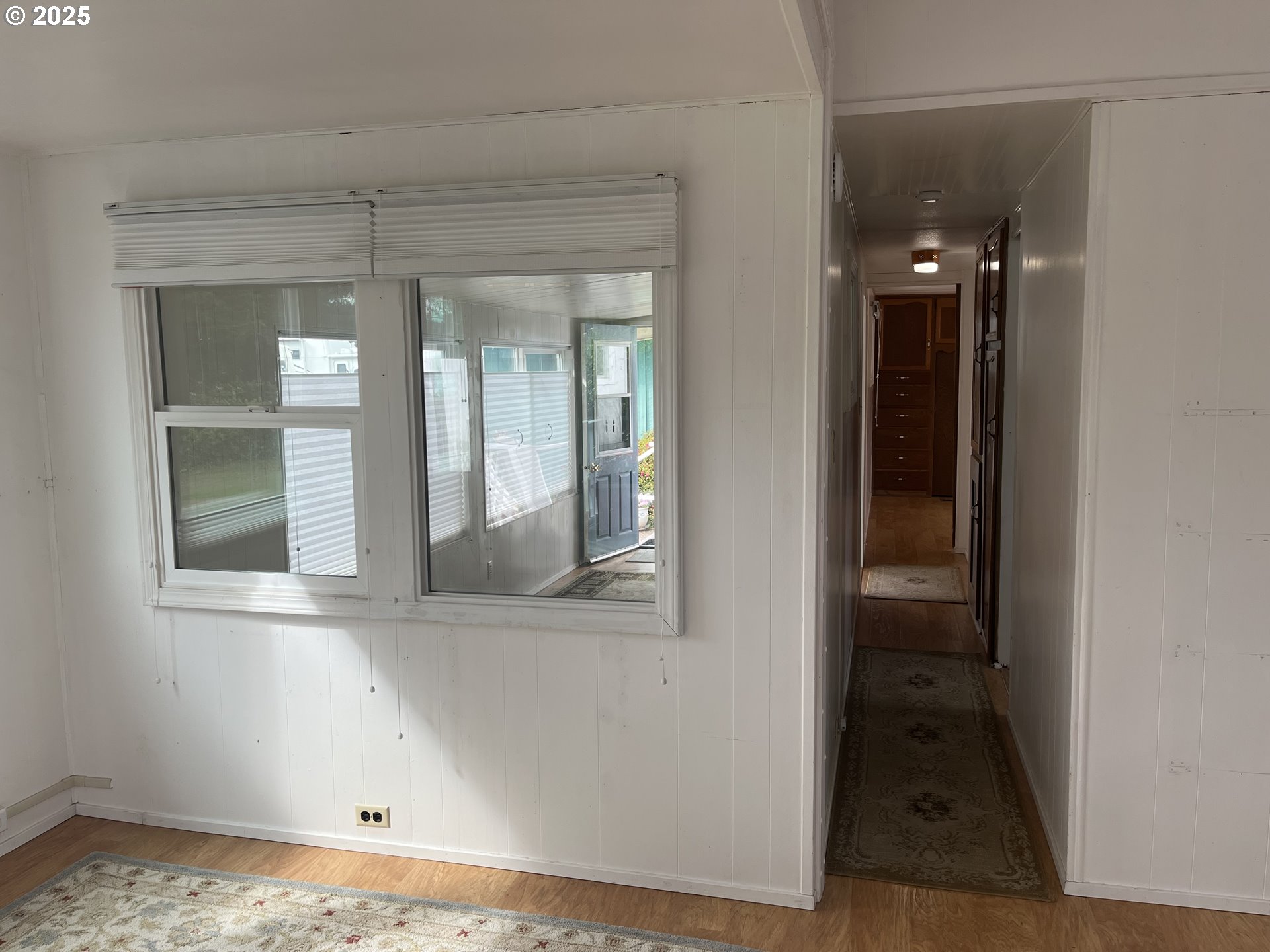83763 Highway 101, Unit 14 Florence, OR 97439 - Photo 22 of 33 wooden floor and window in a room