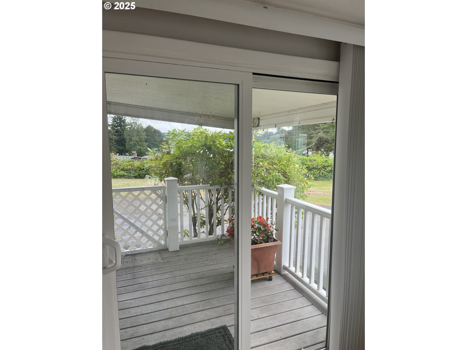 83763 Highway 101, Unit 14 Florence, OR 97439 - Photo 24 of 33 a view of a room with wooden floor and a porch