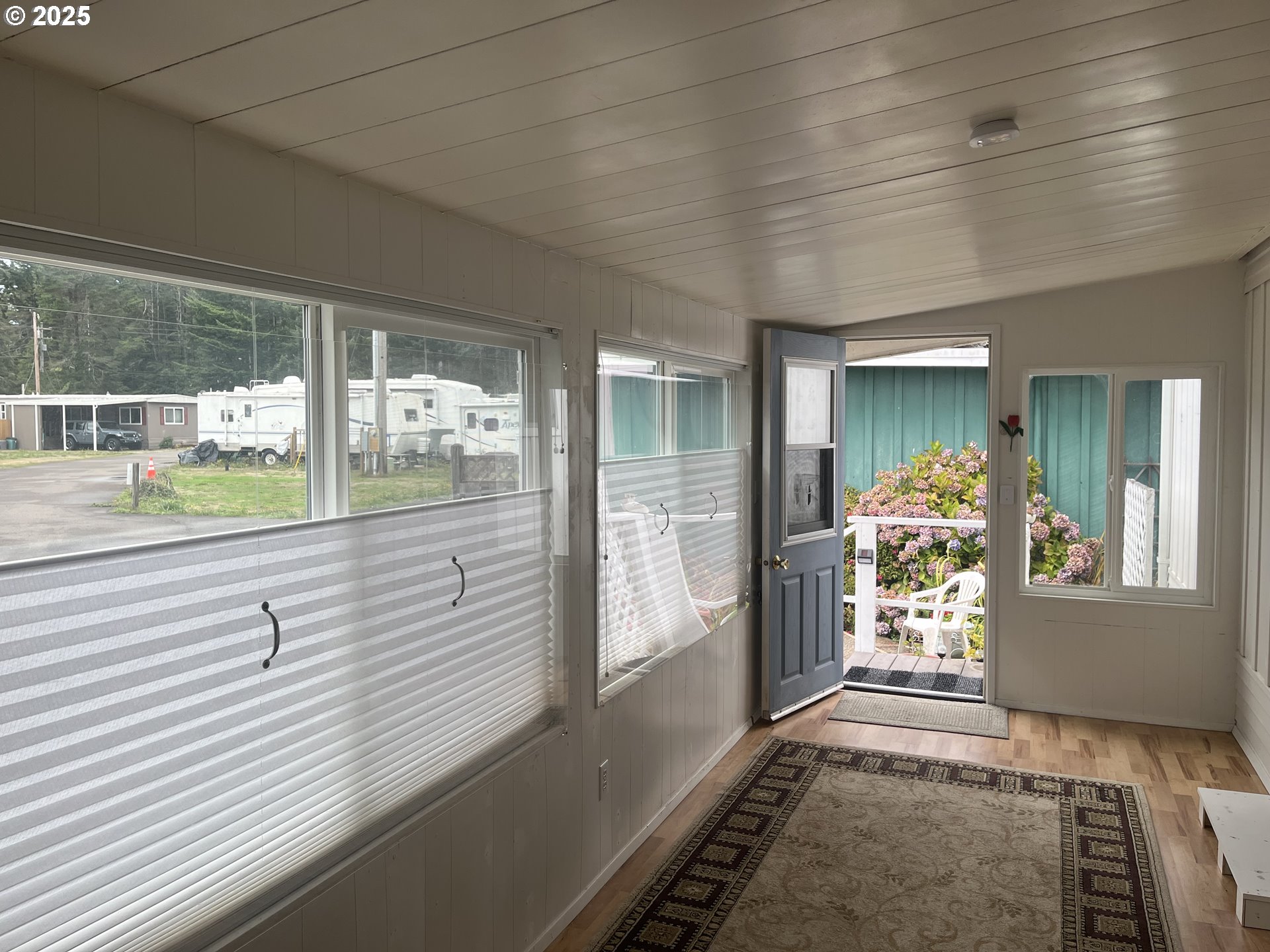 83763 Highway 101, Unit 14 Florence, OR 97439 - Photo 27 of 33 a view of hallway with furniture and a large window