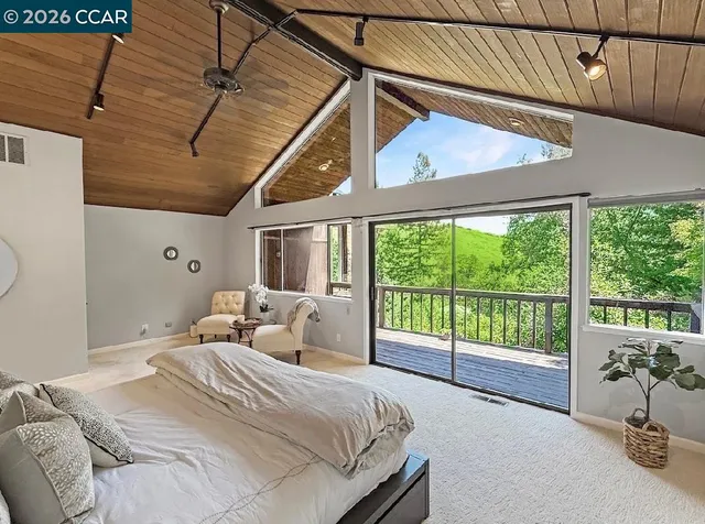 a spacious bathroom with a granite countertop double vanity sink and a mirror