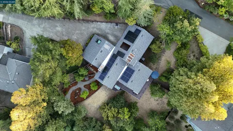 an aerial view of a house with outdoor space and street view
