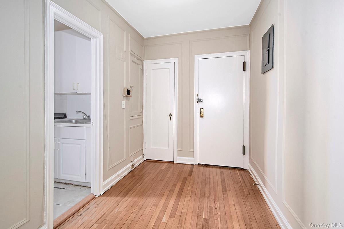 151 Centre Avenue, Unit 5D New Rochelle, NY 10805 - Photo 4 of 17 a view of a hallway with wooden floor and closet area