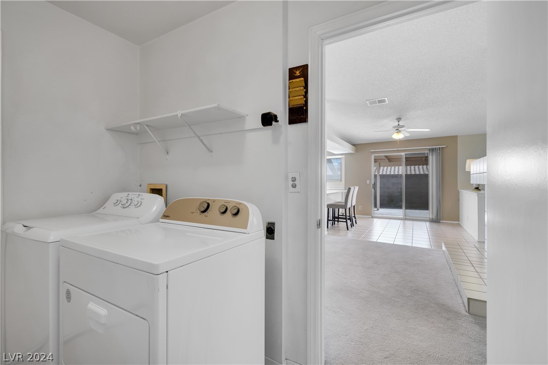 212 Pocahontas Court Henderson, NV 89074 - Photo 20 of 28 view of laundry room with garage door to the left