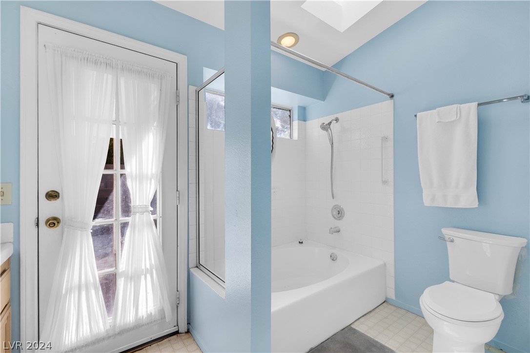212 Pocahontas Court Henderson, NV 89074 - Photo 22 of 28 primary bathroom with door to backyard, garden tub