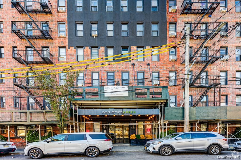 42-22 Ketcham Street, Unit 3E Queens, NY 11373 - Photo 1 of 8 a front view of a building with cars parked