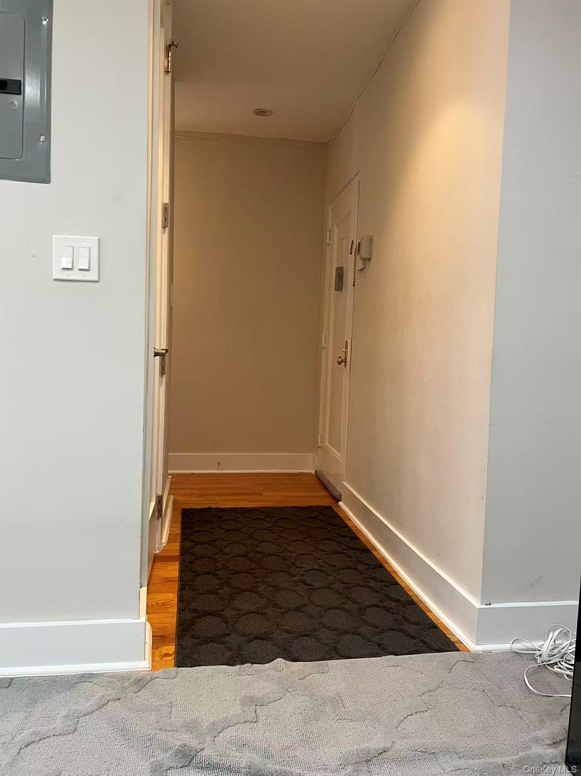 42-22 Ketcham Street, Unit 3E Queens, NY 11373 - Photo 5 of 8 a view of a hallway